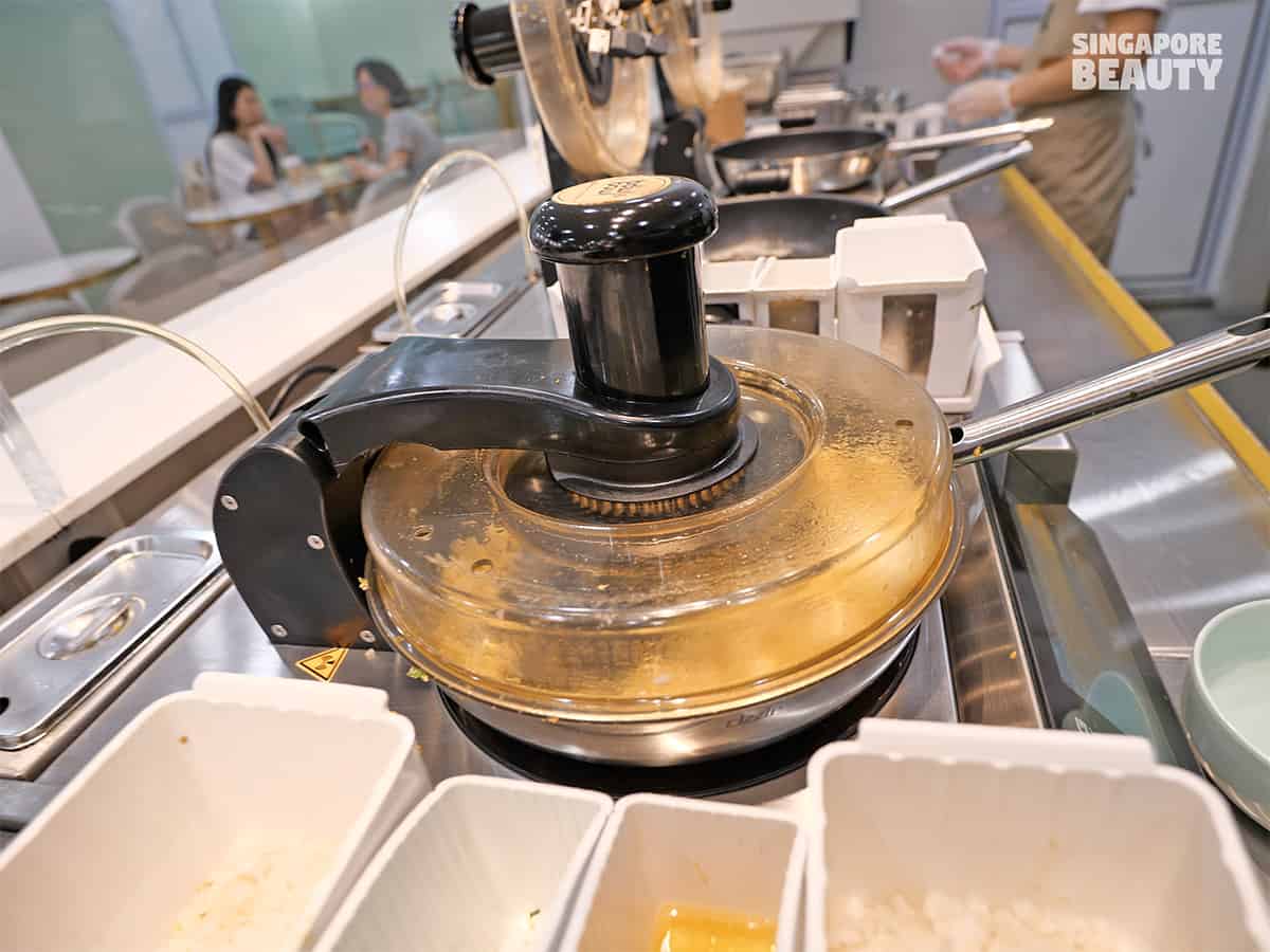 robot stir frying egg